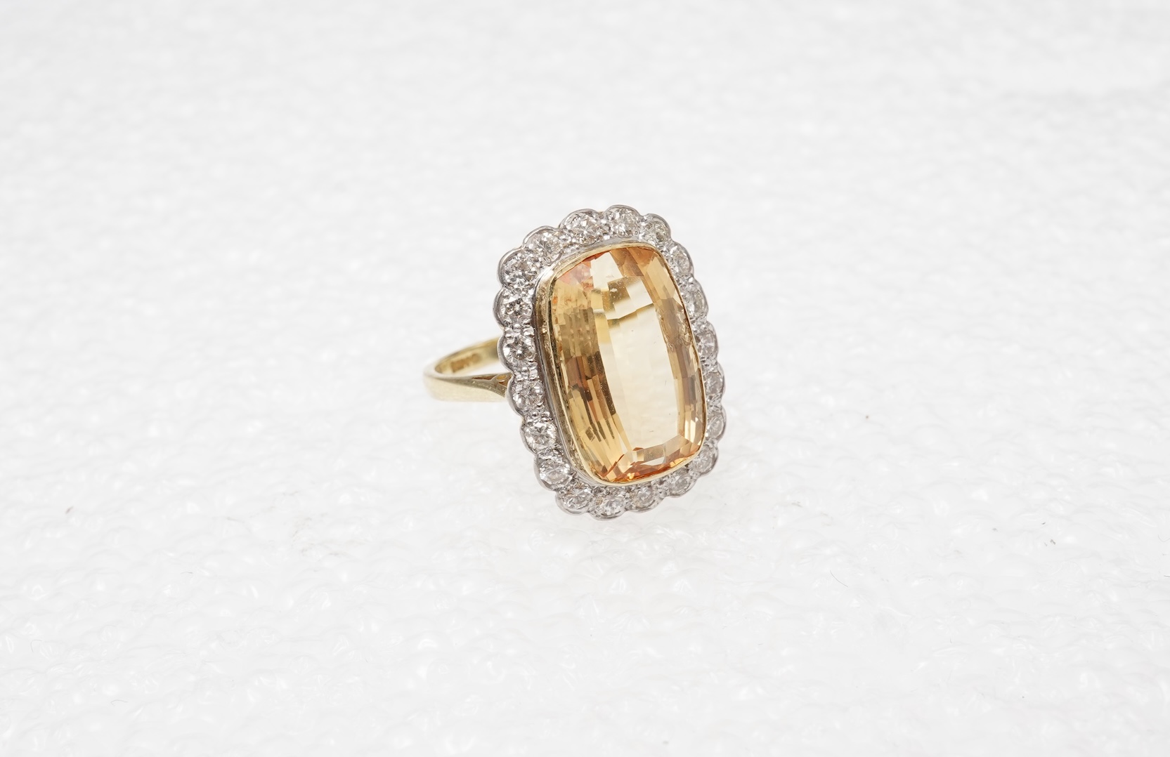 A topaz and diamond cluster ring